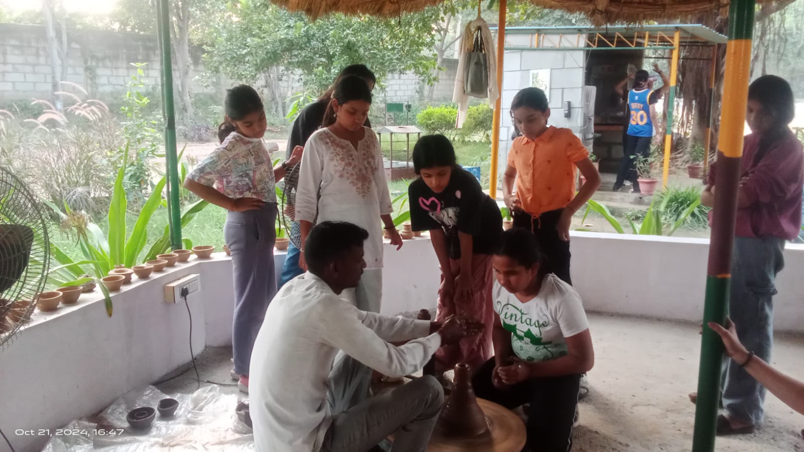 Kids Learning Pottery Wheel Activity